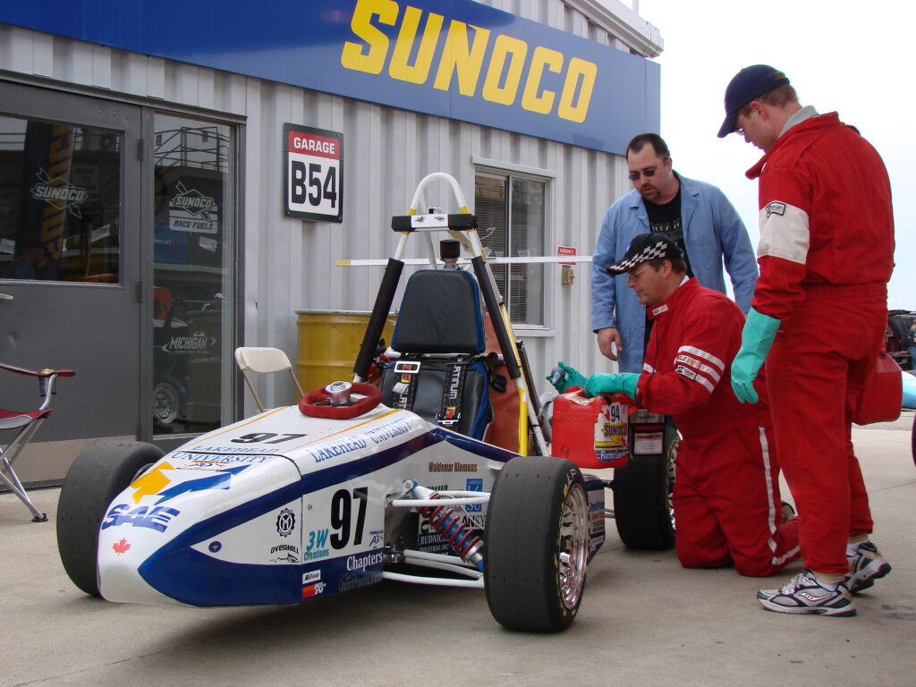 car being filled with gas at the competition